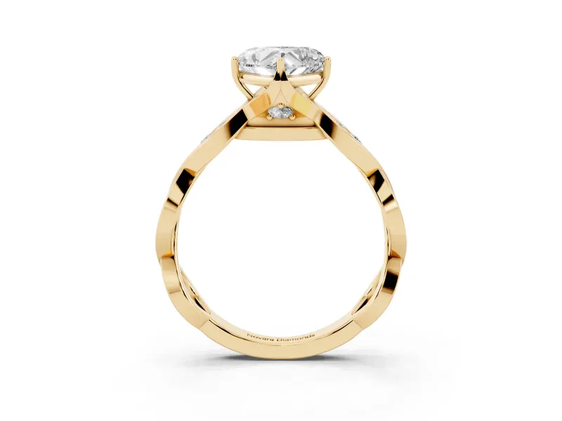 Heart Cut Diamond Twist Band Solitaire Ring Set in Yellow gold with Leaf Prong Setting and Accent Stones