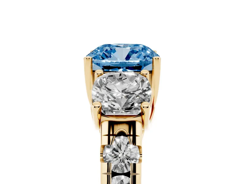 Fancy Blue Cushion Cut Diamond Three-Stone Ring Set in Yellow gold with Pavé Band