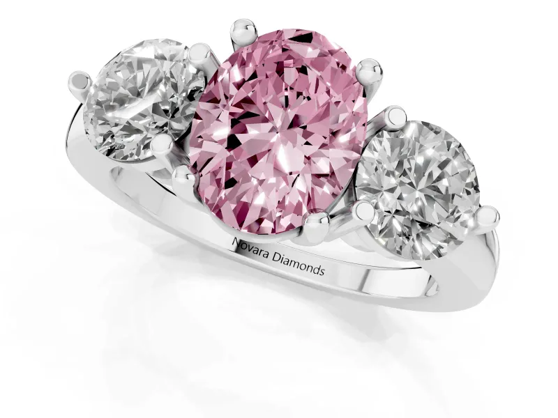 Fancy Pink Oval Cut Diamond Three-Stone Ring Set in Platinum with Prong Setting and Classic Band