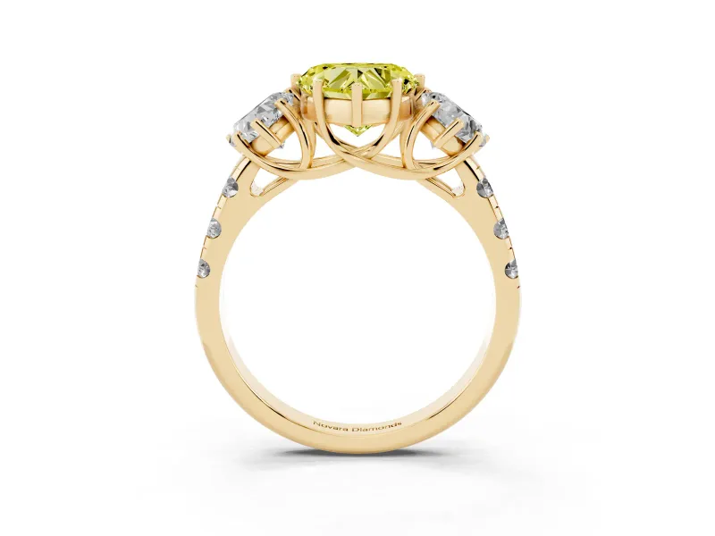 Fancy Yellow Heart Cut Diamond Three-Stone Ring Set in Yellow gold with Pavé Band