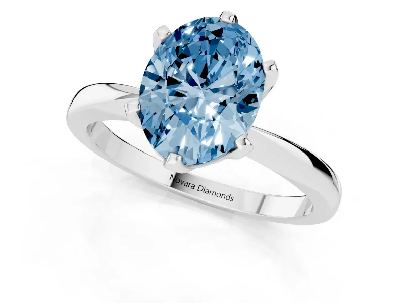 Fancy Blue Oval Cut Diamond Solitaire Engagement Ring Set in Platinum with Slim Tapered Solitaire Band