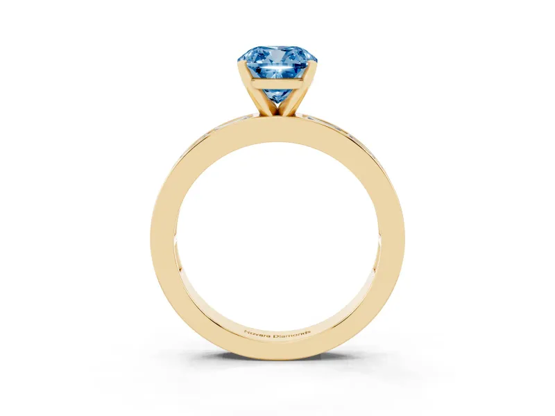 Fancy Blue Cushion Cut Diamond Solitaire Ring Set in Yellow gold with Channel-Set Baguette Band and Prong Setting