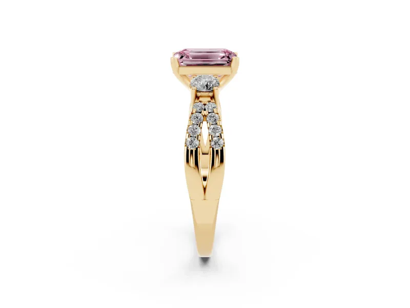 Fancy Pink Emerald Cut Diamond Three-Stone Ring Set in Yellow gold with Pavé Split Shank and Prong Setting