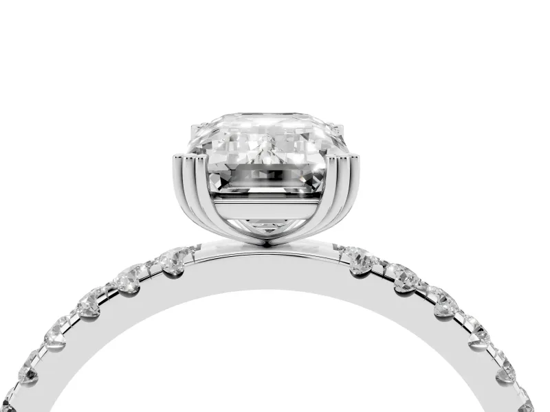 Emerald Cut Diamond Brilliant Solitaire Set in White gold with Pavé Band and Claw Prong Setting