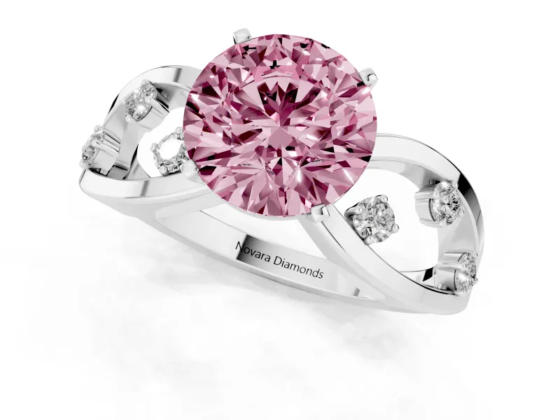 Fancy Pink Round Cut Diamond Solitaire Ring Set in White gold with Side Stones on Criss-Cross Band and Prong Setting