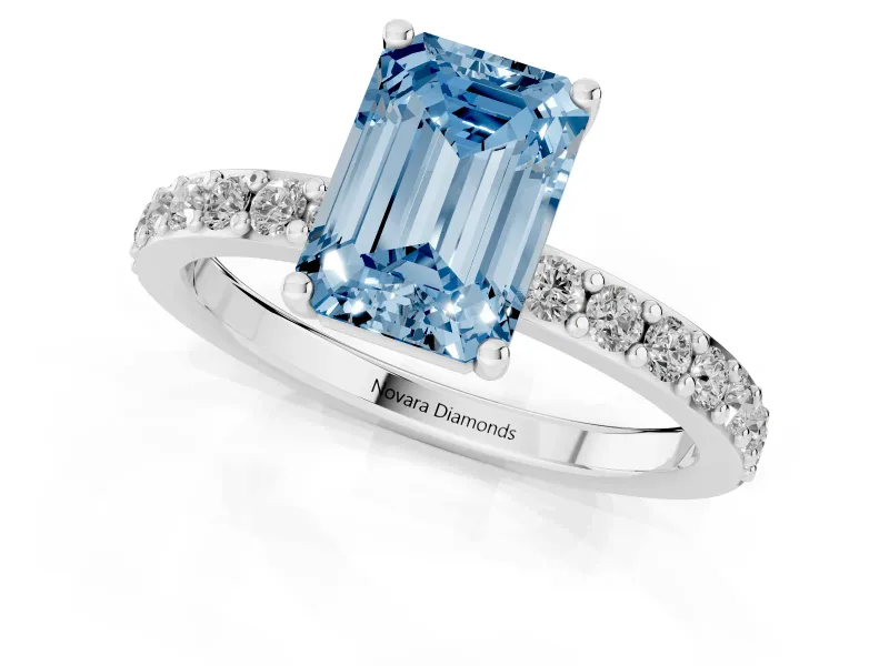 Fancy Blue Emerald Cut Diamond Solitaire Set in Silver with Round Pavé Band and Prong Setting