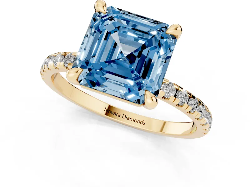 Fancy Blue Asscher Cut Diamond Brilliant Solitaire Ring Set in Yellow gold with Pavé Band and Prong Setting