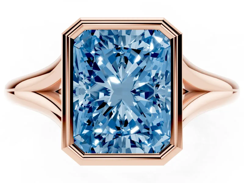 Fancy Blue Bezel Set Radiant Cut Diamond Solitaire Ring Set in Rose gold with Tapered Band