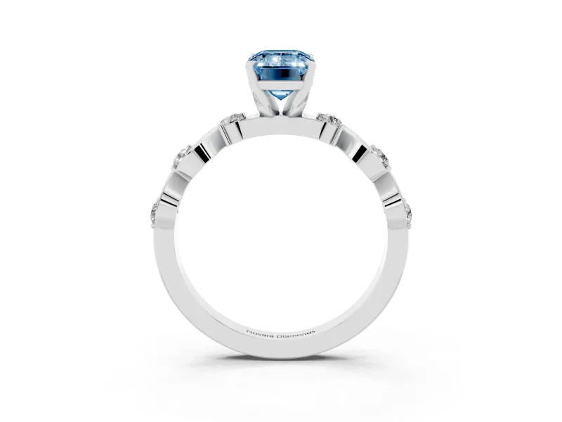 Fancy Blue Emerald Cut Diamond Solitaire Ring Set in White gold with Ribbon Twist Band, Round Accents and Prong Setting
