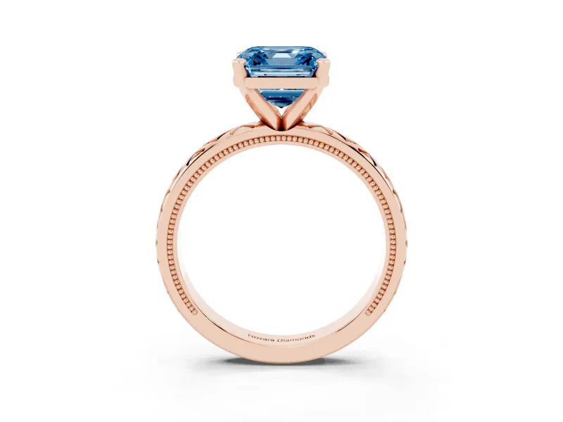 Fancy Blue Asscher Cut Diamond Solitaire Ring Set in Rose gold with Milgrain and Black Enamel X Pattern Band