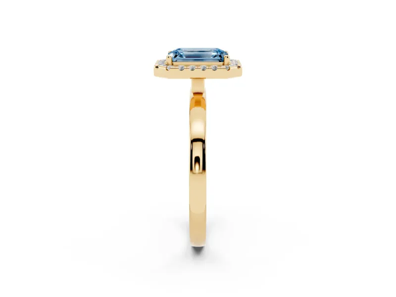 Fancy Blue Emerald Cut Diamond Halo Solitaire Ring Set in Yellow gold with Pavé Band and Prong Setting