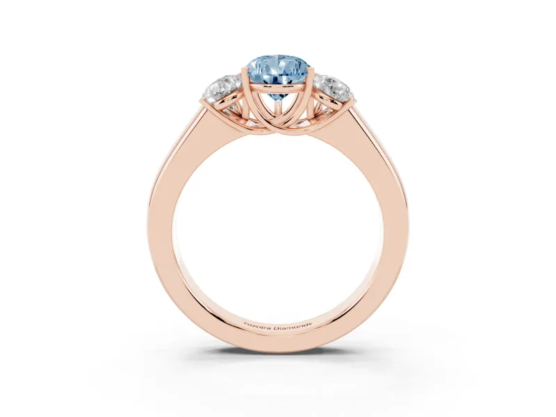 Fancy Blue Three-Stone Pear Cut Diamond Ring Set in Rose gold with Matching Prong Settings and Plain Band