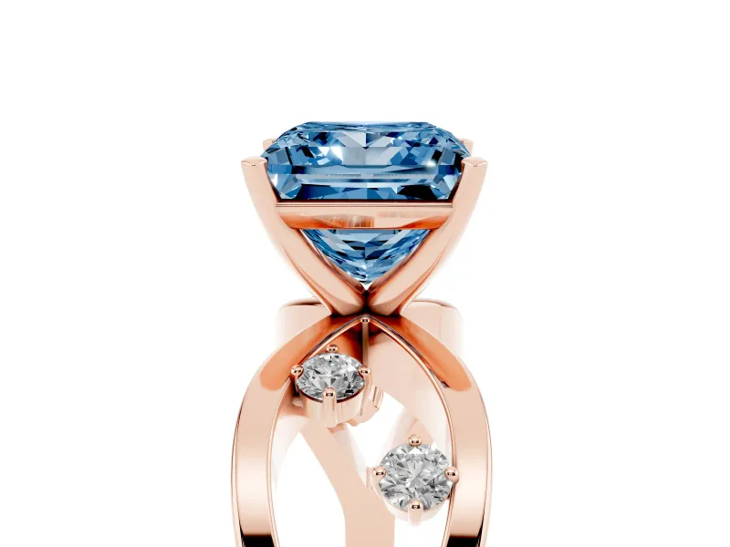 Fancy Blue Princess Cut Diamond Solitaire Ring Set in Rose gold with Side Stones on Criss-Cross Band and Prong Setting