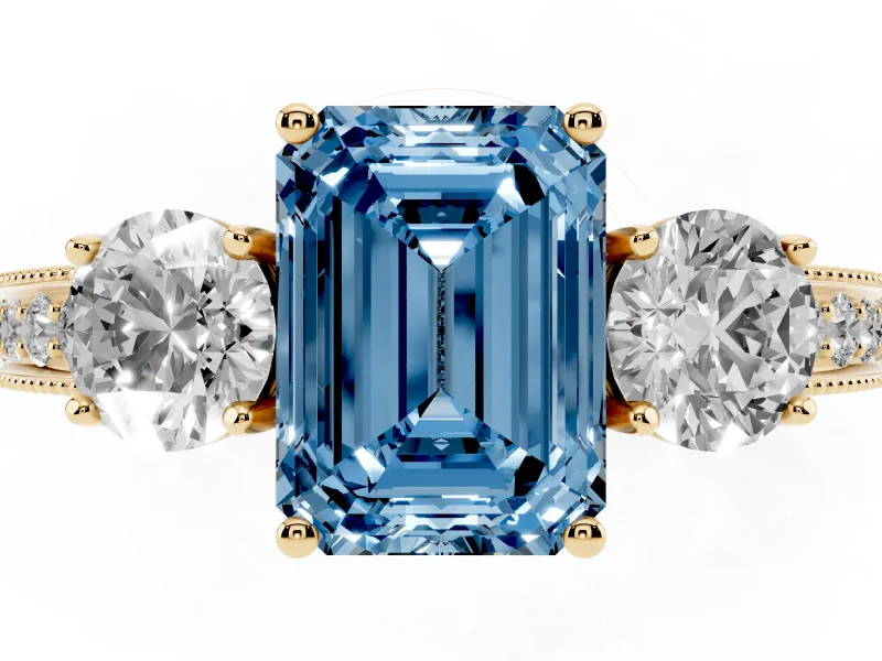 Emerald Cut Three Stone Engagement Ring Setting for a Fancy Blue Lab-Grown Diamond | Graduated Pave Band | Yellow Gold