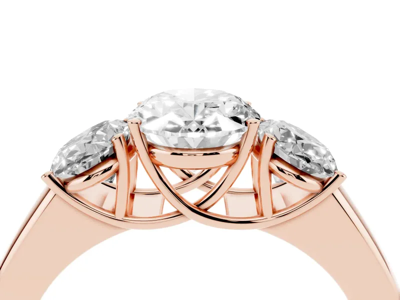 Three-Stone Oval Cut Diamond Ring Set in Rose gold with Matching Prong Settings and Plain Band