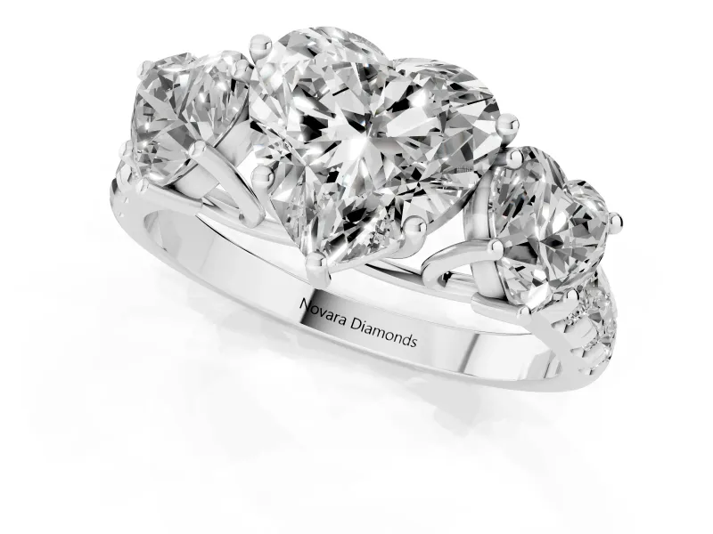 Heart Cut Diamond Three-Stone Ring Set in Platinum with Pavé Band