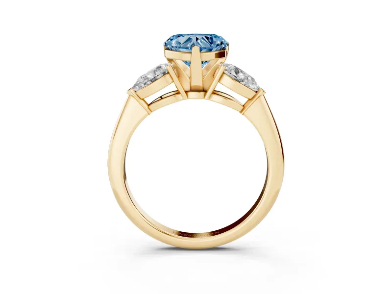Fancy Blue Three-Stone Heart Cut Diamond Ring Set in Yellow gold with Pear Side Stones and Prong Setting