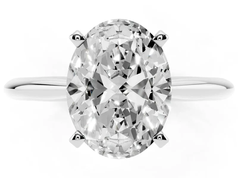 Oval Cut Diamond Solitaire Ring Set in Platinum with Prong Setting on a Plain Round Band