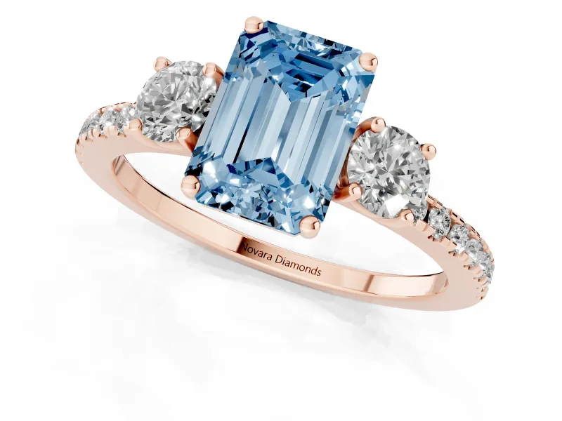 Emerald Cut Three Stone Engagement Ring Setting for a Fancy Blue Lab-Grown Diamond | Pave Shoulders | Rose Gold