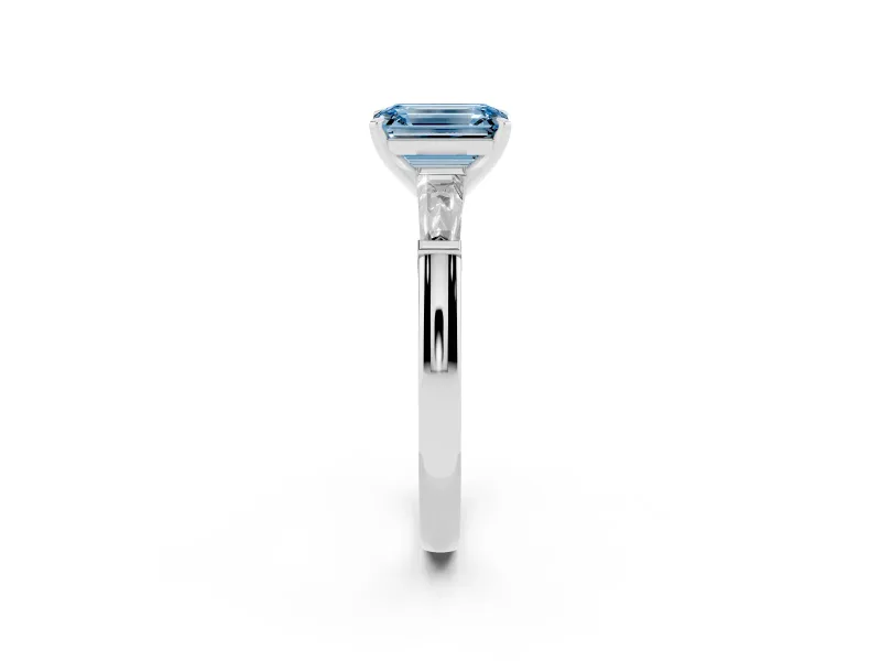 Fancy Blue Emerald Cut Diamond Solitaire Ring Set in Platinum with Tapered Baguette Side Stones and Prong Setting