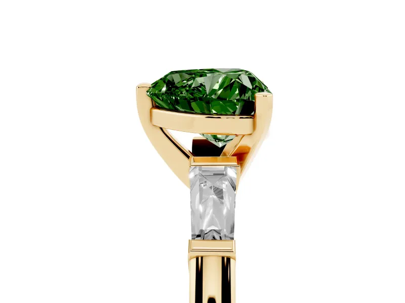 Fancy Green Heart Cut Diamond Solitaire Ring Set in Yellow gold with Tapered Baguette Side Stones and Prong Setting