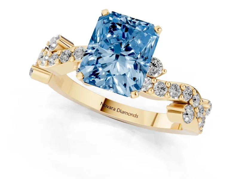 Fancy Blue Radiant Cut Diamond Solitaire Twisted Band Set in Yellow gold with Pavé Setting