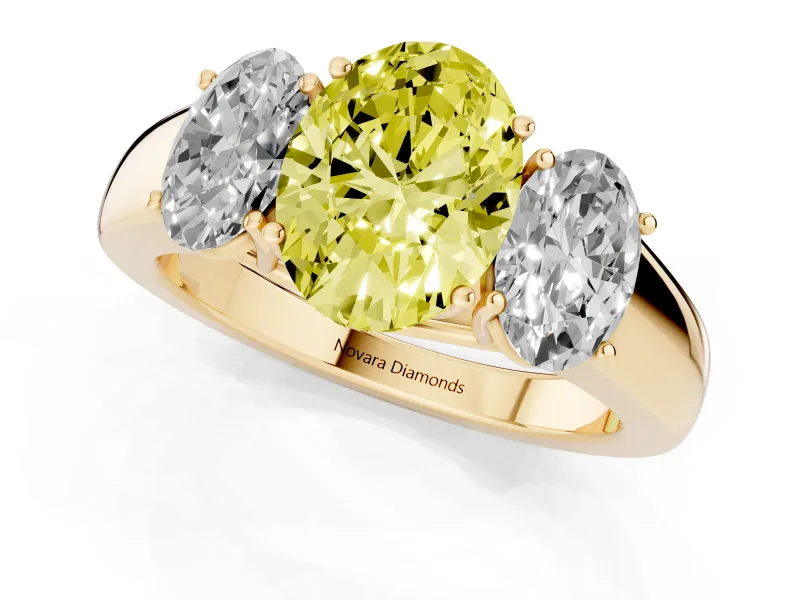 Fancy Yellow Three-Stone Oval Cut Diamond Ring Set in Yellow gold with Matching Prong Settings and Plain Band