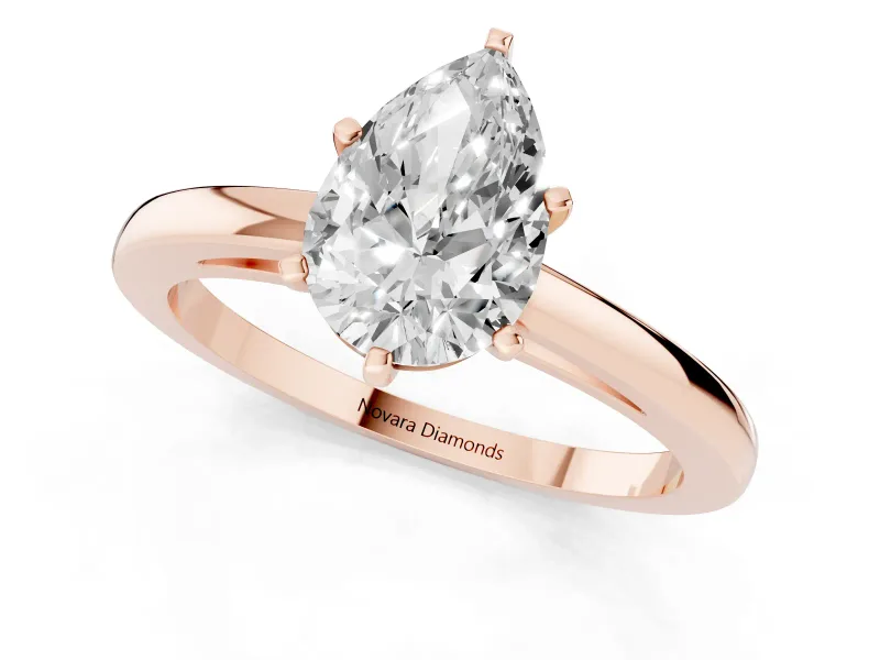 Pear Cut Diamond Solitaire Engagement Ring Set in Rose gold with Prong Setting on a Classic Band