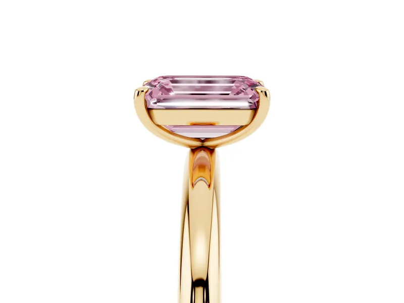 Fancy Pink Emerald Cut Diamond Solitaire Ring Set in Yellow gold with Prong Setting on a Polished Plain Band