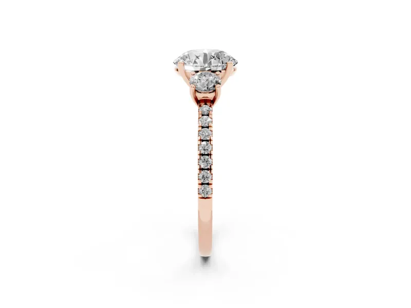 Round Cut Diamond Three-Stone Ring Set in Rose gold with Pavé Band and Graduated Sides
