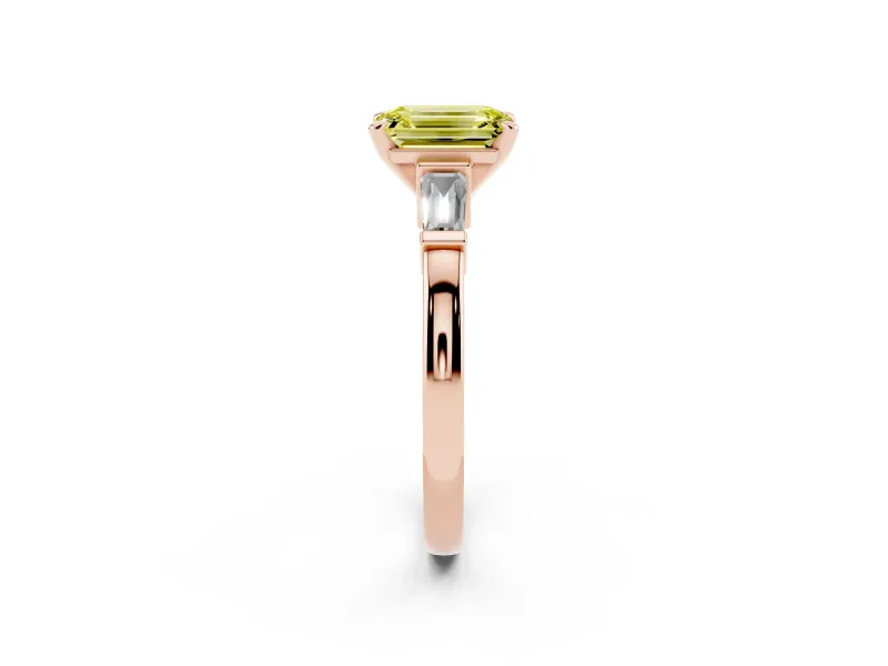 Fancy Yellow Emerald Cut Diamond Solitaire Ring Set in Rose gold with Tapered Baguette Accents and Prong Setting