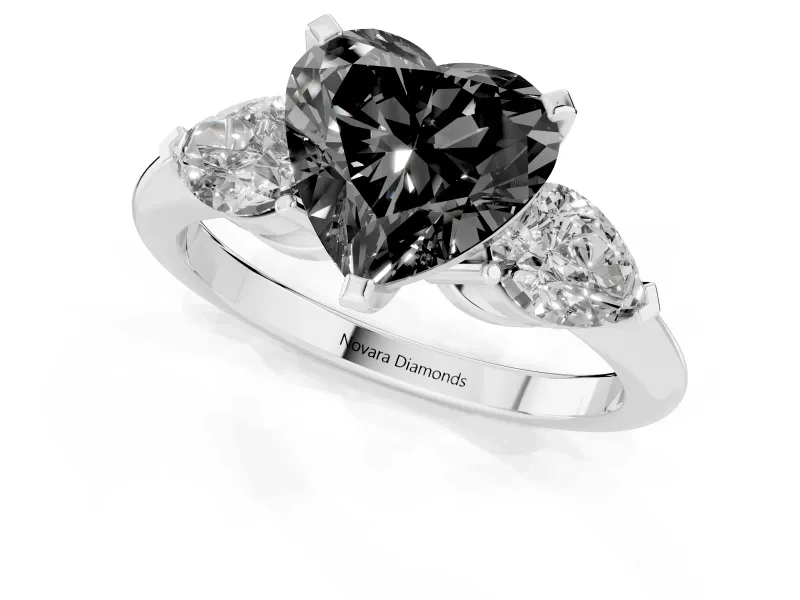 Fancy Black Three-Stone Heart Cut Diamond Ring Set in Platinum with Pear Side Stones and Prong Setting