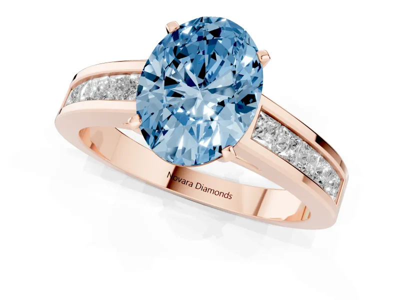 Fancy Blue Oval Cut Diamond Solitaire Ring Set in Rose gold with Channel-Set Band and Prong Setting