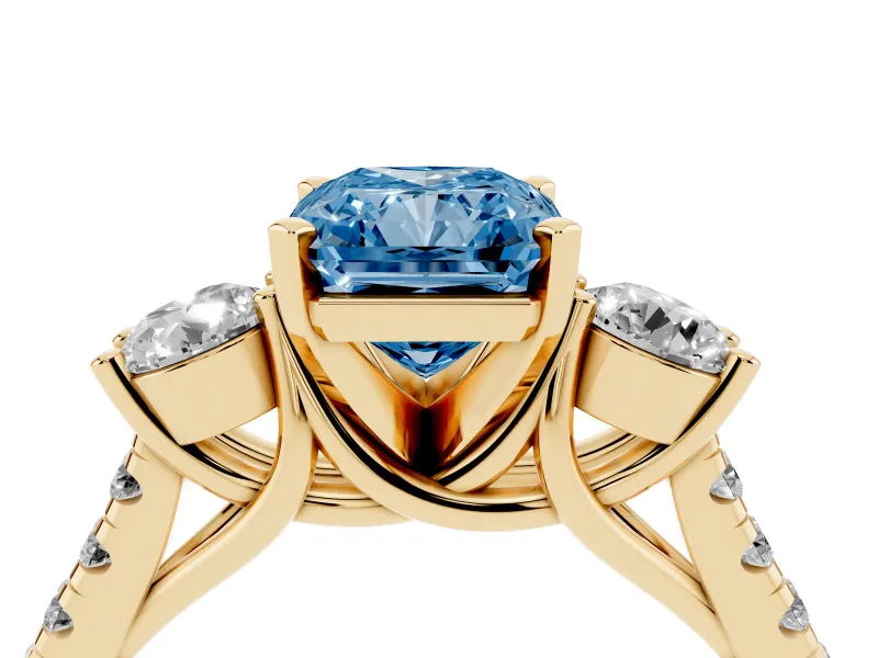 Fancy Blue Three-Stone Radiant Cut Diamond Pavé Band Ring Set in Yellow gold with Prong-Set Trio