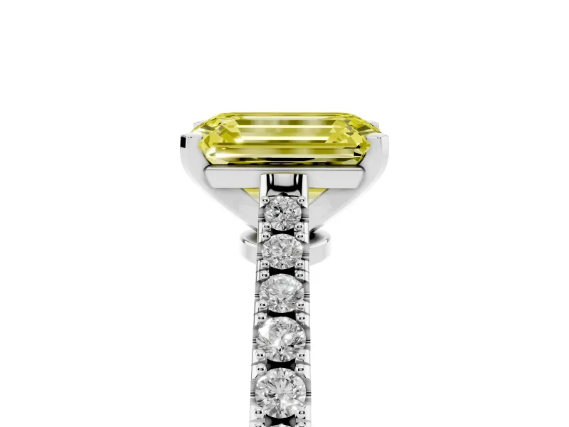 Fancy Yellow Emerald Cut Diamond Solitaire Engagement Ring Set in Platinum with Delicate Pavé Band and Prong Setting