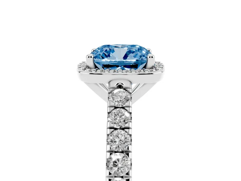 Fancy Blue Cushion Cut Diamond Halo Engagement Ring Set in White gold with Pavé Band and Prong Setting