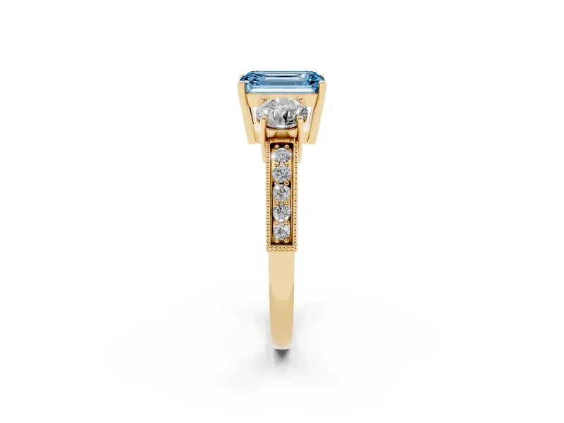 Emerald Cut Three Stone Engagement Ring Setting for a Fancy Blue Lab-Grown Diamond | Graduated Pave Band | Yellow Gold