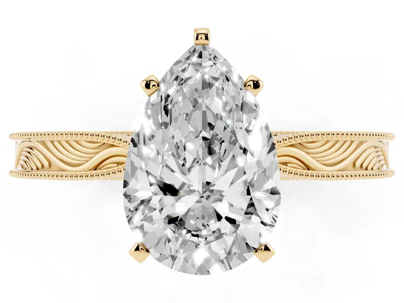 Pear Cut Diamond Solitaire Milgrain Engraved Band Set in Yellow gold with Prong Setting