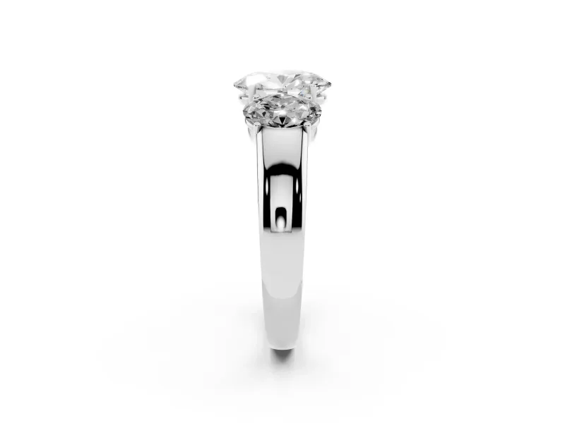 Three-Stone Oval Cut Diamond Ring Set in White gold with Matching Prong Settings and Plain Band