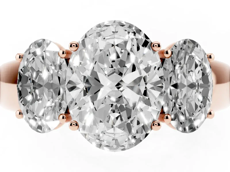Three-Stone Oval Cut Diamond Ring Set in Rose gold with Matching Prong Settings and Plain Band
