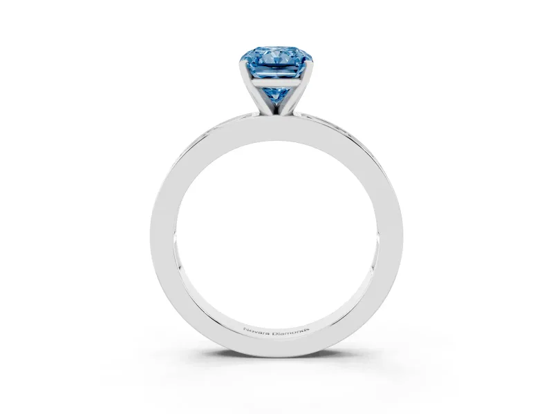 Fancy Blue Radiant Cut Diamond Solitaire Ring Set in Silver with Channel-Set Baguette Band and Prong Setting