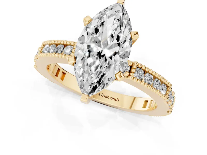 Marquise Cut Diamond Solitaire Ring Set in Yellow gold with Slim Pavé Band and Prong Setting
