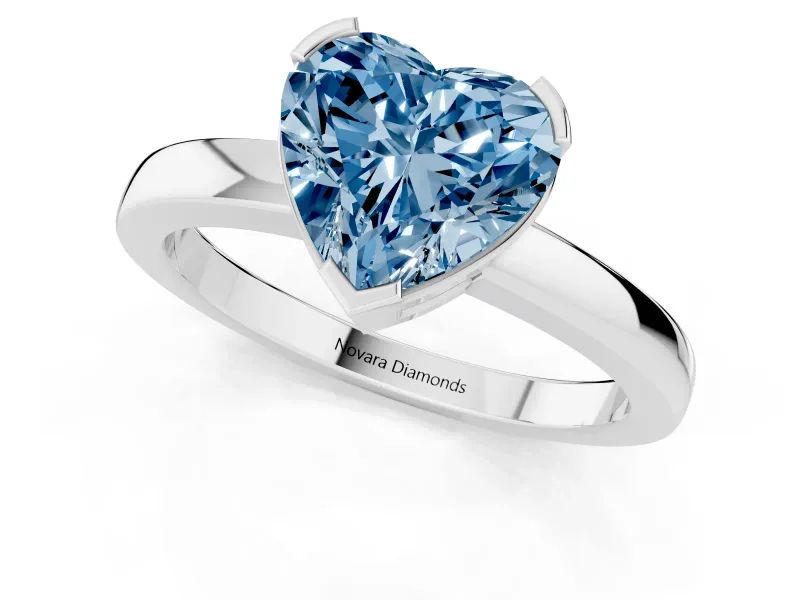 Fancy Blue Heart Cut Diamond Solitaire Ring Set in Platinum with Prong Head and Smooth Polished Band