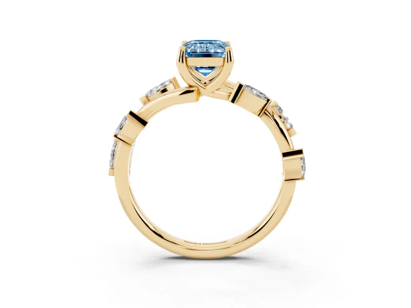 Fancy Blue Emerald Cut Diamond Solitaire Ring Set in Yellow gold with Twisted Marquise Accent Band