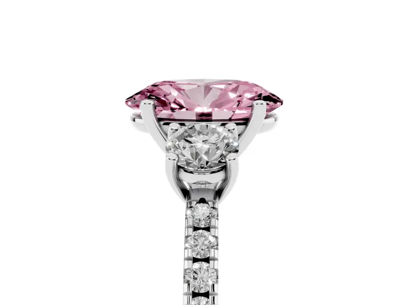 Fancy Pink Oval Cut Diamond Three-Stone Ring Set in Platinum with Pavé Band and Graduated Sides