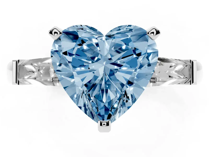 Fancy Blue Heart Cut Diamond Solitaire Ring Set in Silver with Tapered Baguette Side Stones and Prong Setting