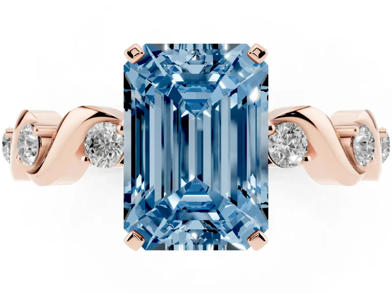 Fancy Blue Emerald Cut Diamond Solitaire Ring Set in Rose gold with Ribbon Twist Band, Round Accents and Prong Setting