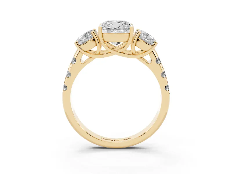 Cushion Cut Diamond Three-Stone Ring Set in Yellow gold with Pavé Band