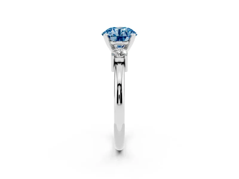 Fancy Blue Three-Stone Round Cut Diamond Ring Set in White gold with Prong Setting and Plain Band