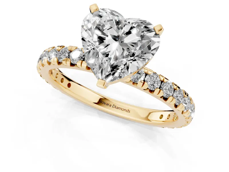 Heart Cut Diamond Pavé Solitaire Ring Set in Yellow gold with Round Band and Prong Setting
